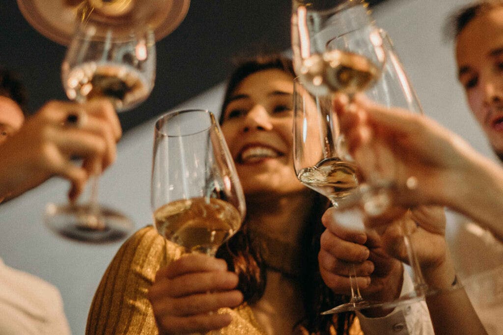 People holding wine glasses