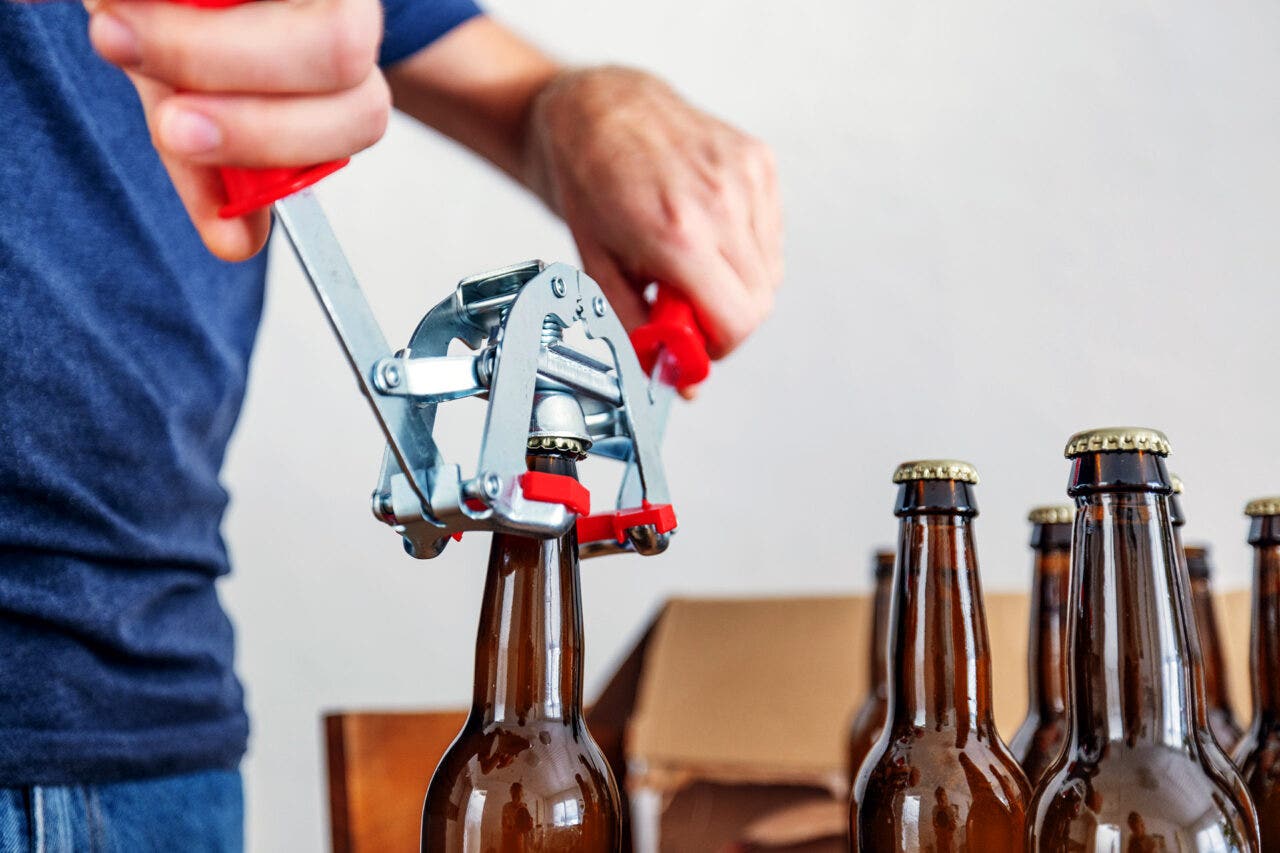 close up on sealing home-brewed beer