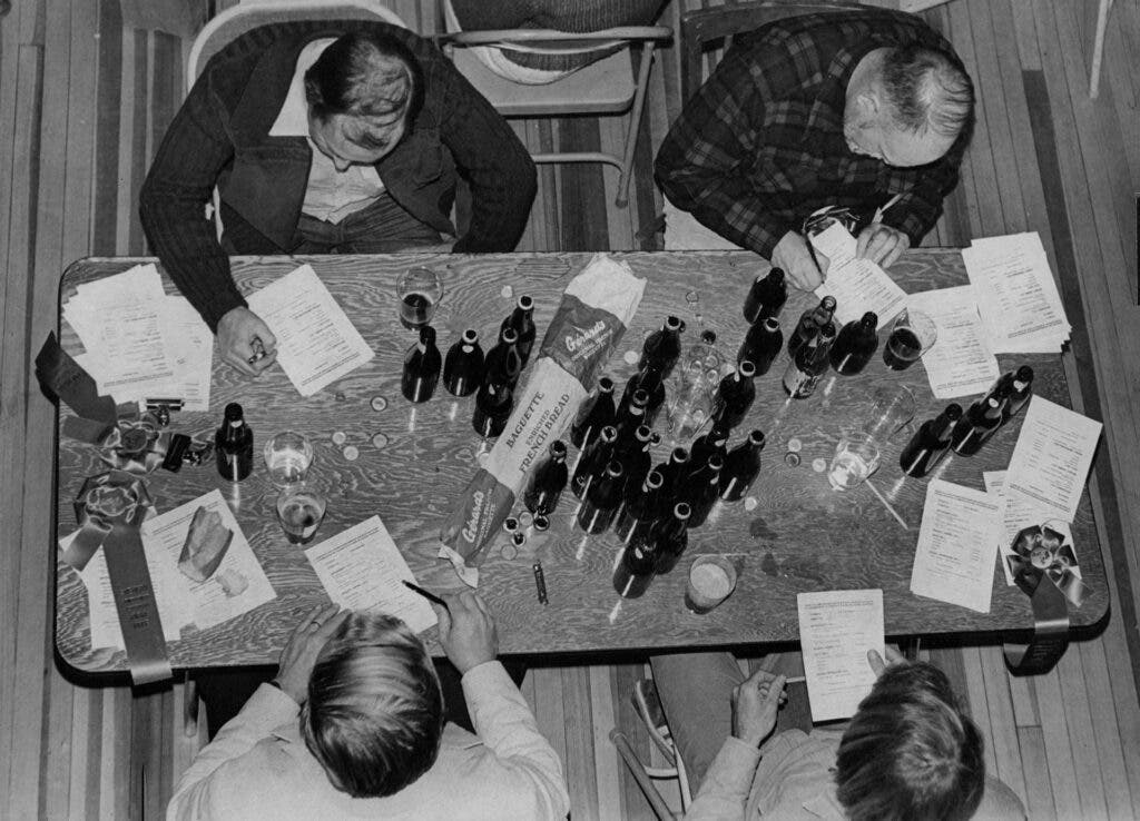 Bottles Of Beer On The Table Four judges mark their score sheets af­ter tasting a variety of homemade brown brews this weekend at the Chau­tauqua Community House in Boulder for the third annual National Home­brew Conference and Competition.