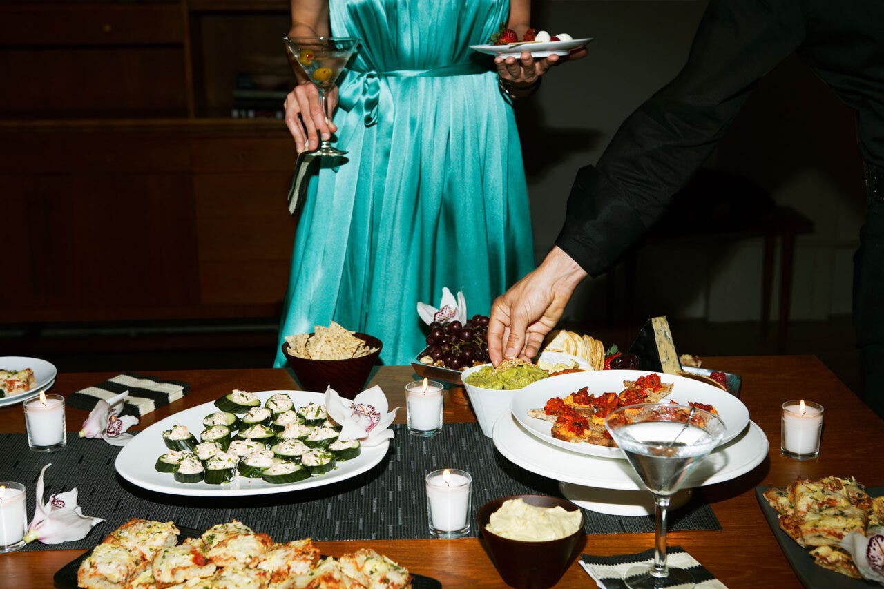 People eating food with cocktails