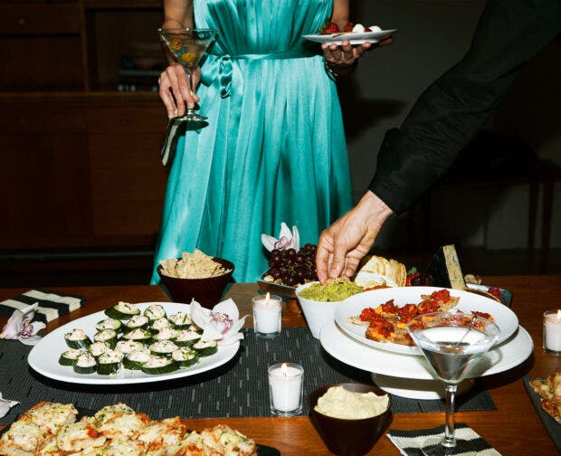 People eating food with cocktails