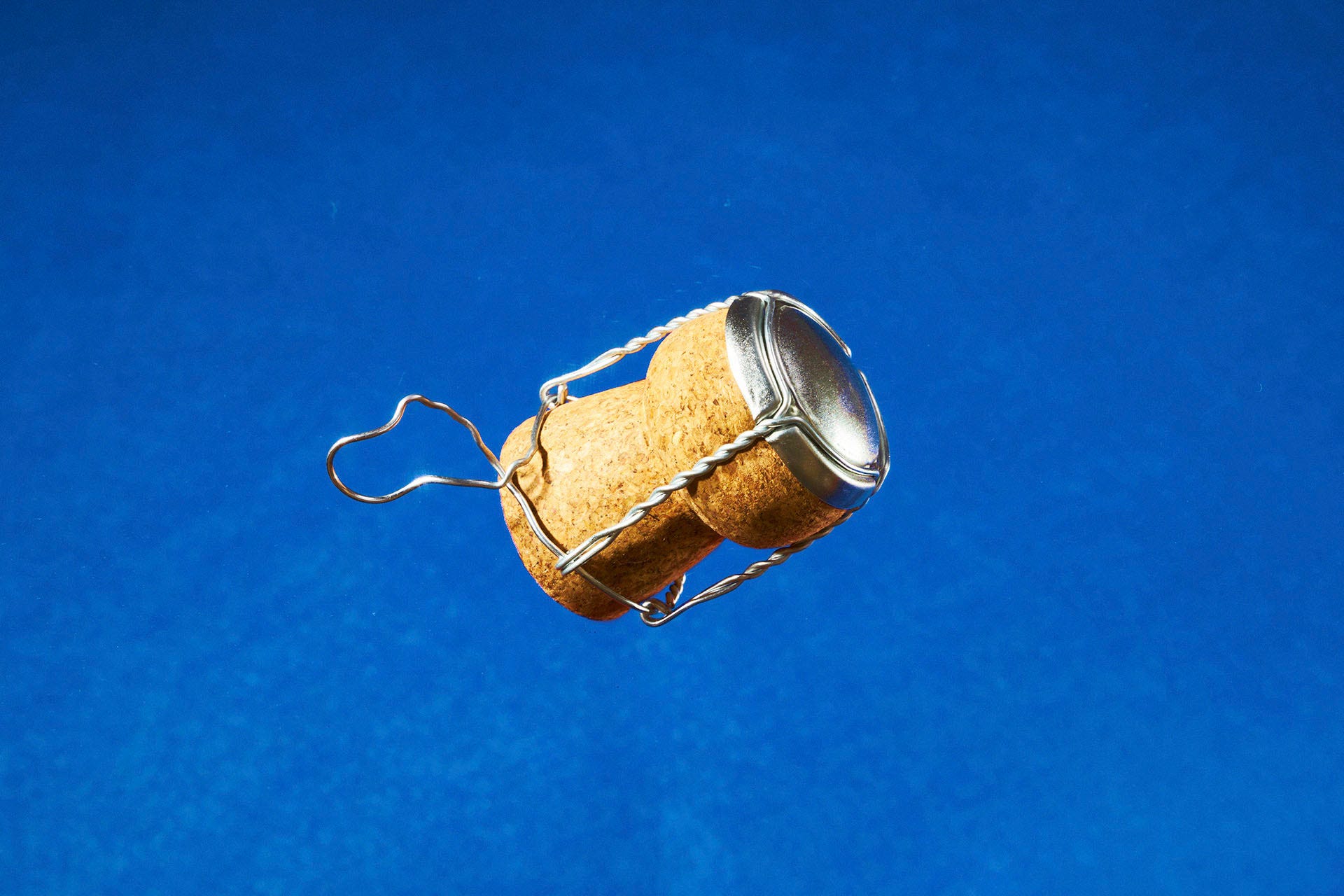 Champagne cork floating through the air