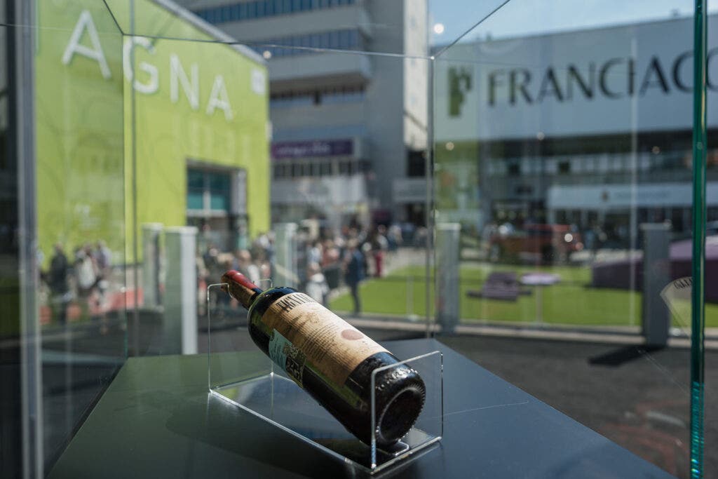 close up on a bottle of wine in a glass box at Vinitaly 2024