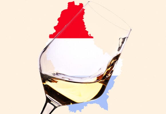 A wine glass in front of a map of Luxembourg