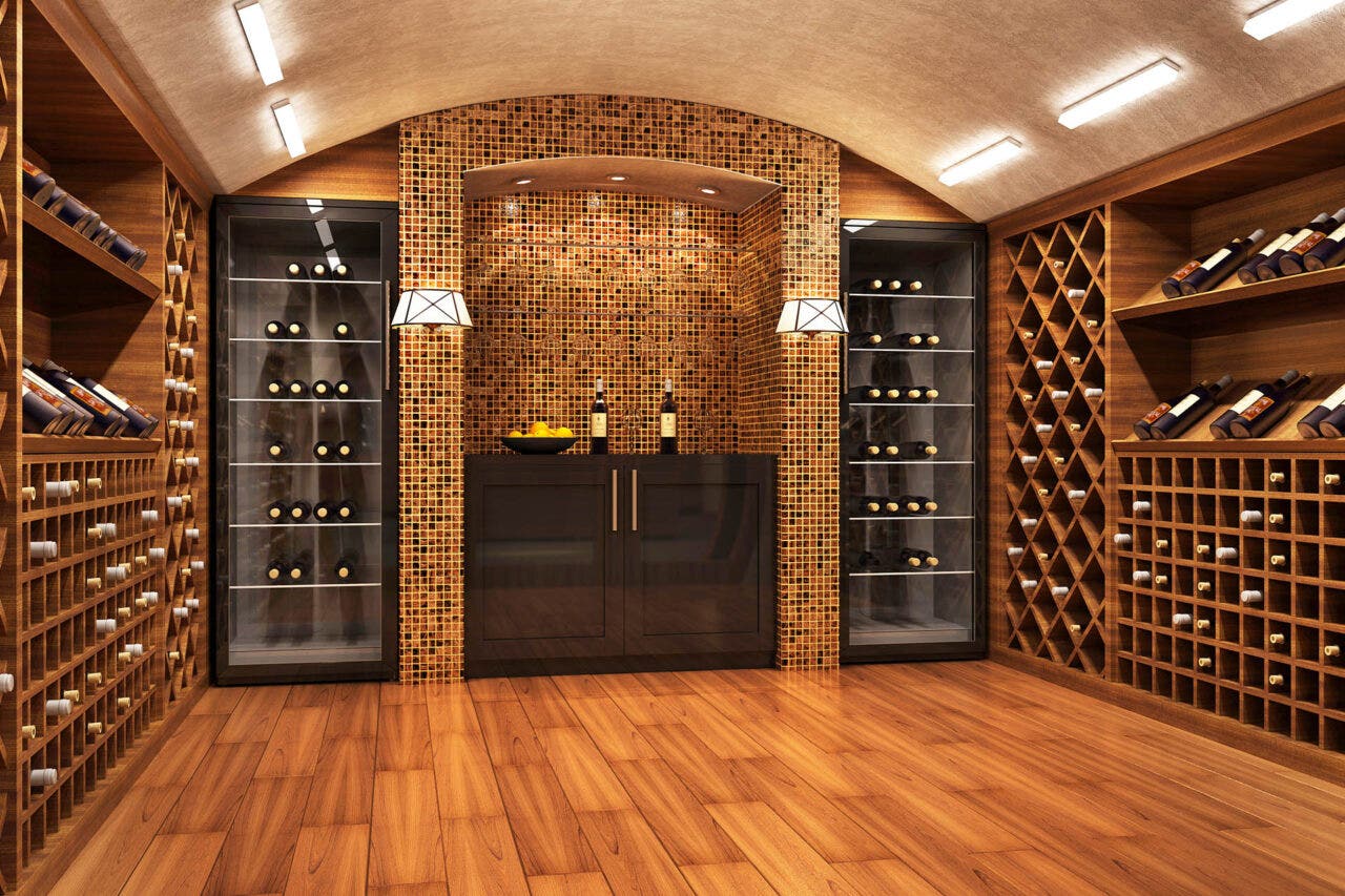 Image of wood floor wine cellar with many bottles on display