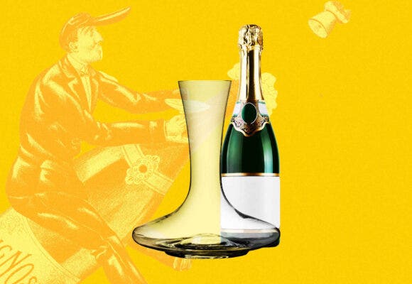 Bottle of champagne next to a decanter